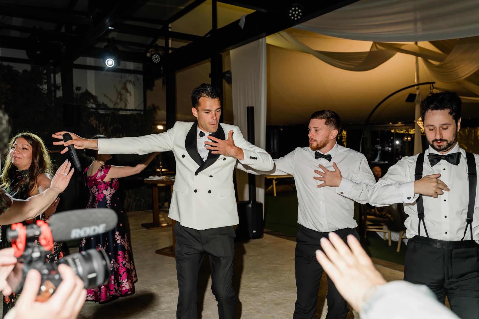 Vova leading guests on the dance floor at Nuray and Adam's wedding in Malaga