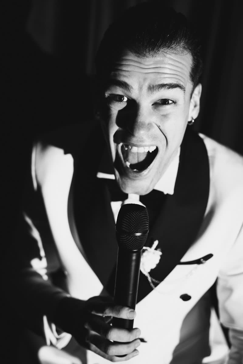 Black and white close portrait of Vova with a microphone